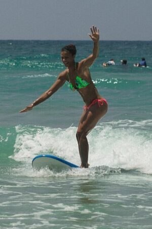 Alysha Clark surfing
